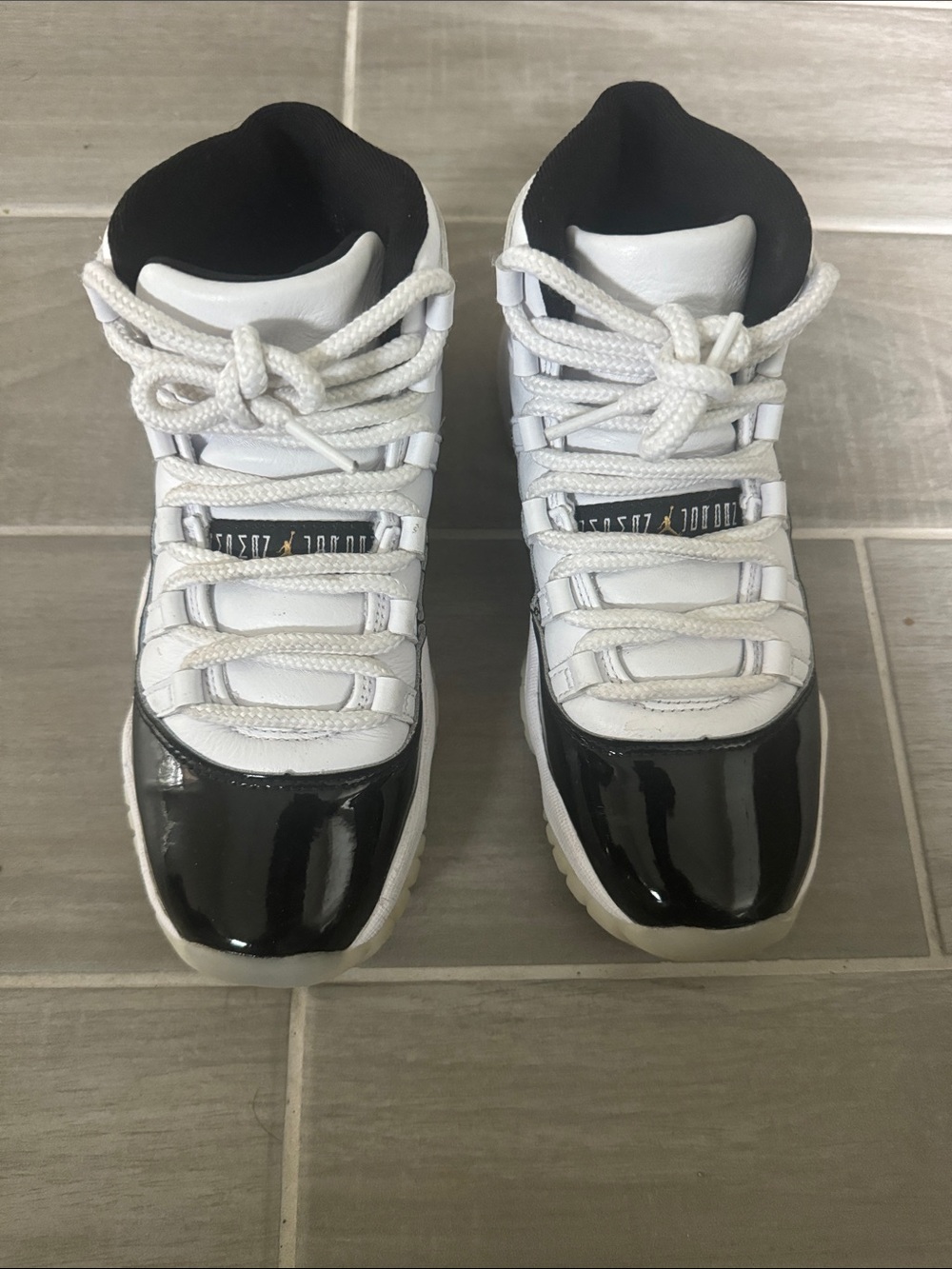 Jordan 11s patent leather black and white